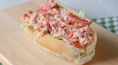 fresh lobster roll on wooden texture