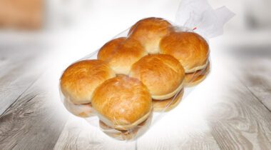 a clear plastic package of round rolls