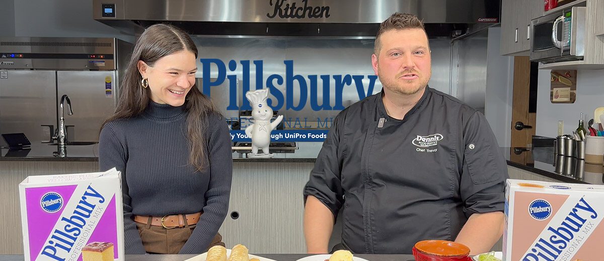man and woman in a kitchen with Pillsbury stuff