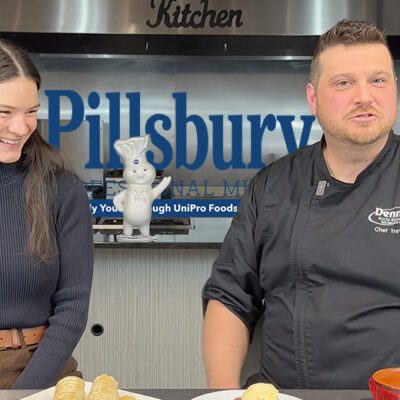 man and woman in a kitchen with Pillsbury stuff