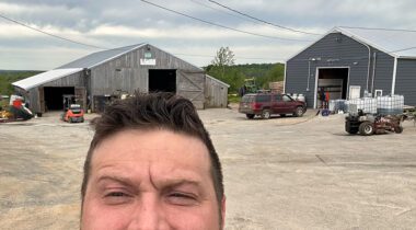 half face selfie with farm equipment backdrop