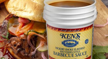 Barbecue smothered sandwich, opened bucket of Ken's Barbecue Sauce