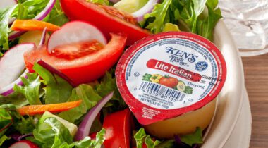 closed cup of Lite Italian dressing on prepared salad
