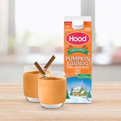 carton of eggnog next to 2 glass cups of eggnog