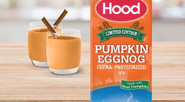 carton of eggnog next to 2 glass cups of eggnog