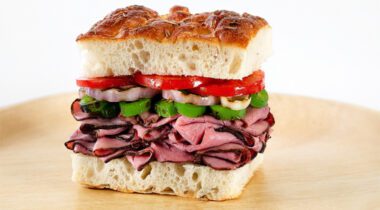 1/4 sandwich with roastbeef, green peppers, onions, and tomatoes