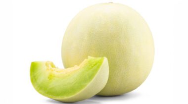slice of honeydew melon next to whole melon