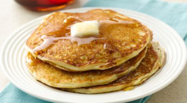 pancakes with butter and syrup on a plate