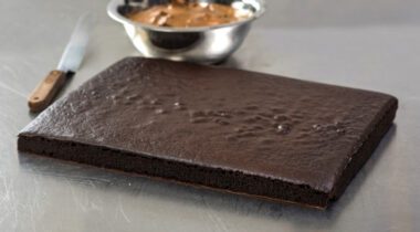 Baked chocolate sheet cake on metal table