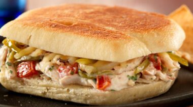 chicken salad mix in between white roll