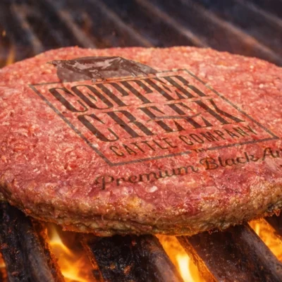 close up of a burger patty on a grill