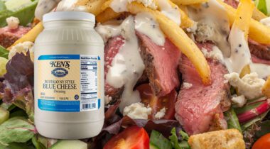 steak salad with blue cheese dressing and inset gallon jug of blue cheese dressing