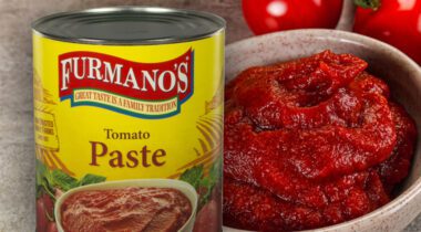 can of Furmano's Tomato Paste over brown bowl full of red tomato paste