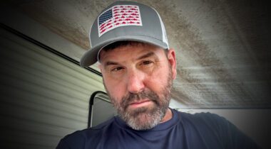 white male wearing baseball cap