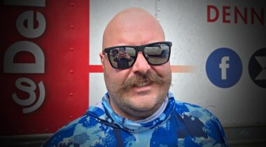 smiling white male with mustache and sunglasses