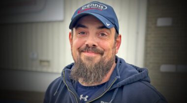 smiling white male wearing baseball cap