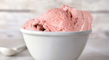 white bowl of pink ice cream