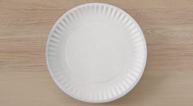 White paper plate on wood setting