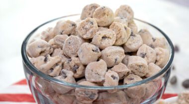 clear bowl of small chunks of chocolate chip cookie dough