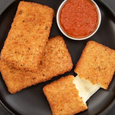 black plate with three mozzarella planks and red dipping sauce