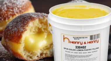 opened bucket of yellow lemon pastry filling over lemon filled donut pastry