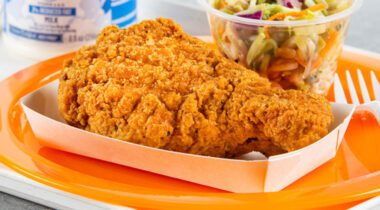 fried chicken drumstick on orange plate