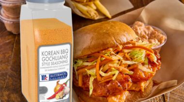 bottle of Korean BBQ seasoning next to chicken sandwich