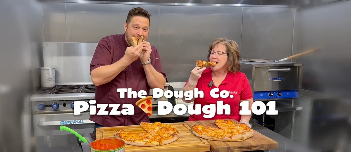 pizza dough 101 graphic image, text over 2 people with pizzas in stainless steel kitchen
