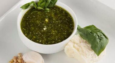 top view of a bowl of basil pesto