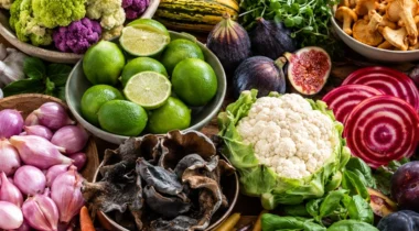 a photo of an assortment/collage of vibrant fruits and vegetables such as limes, shallots, carrots, beats, etc